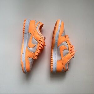 Nike Orange Low-Top Sneakers with Classic Lace-Up Design